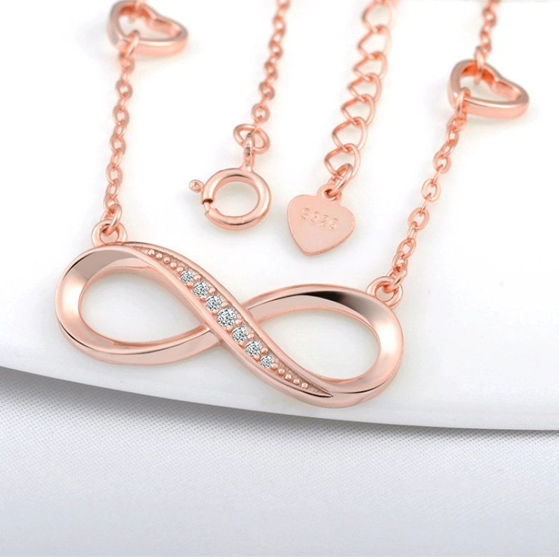 Levně Stříbrný náhrdelník nekonečno se srdíčky Rose Gold
